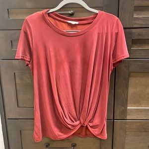 Red top with cute knotted detail on bottom